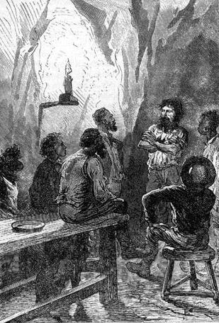 His head was bare, his arms crossed.